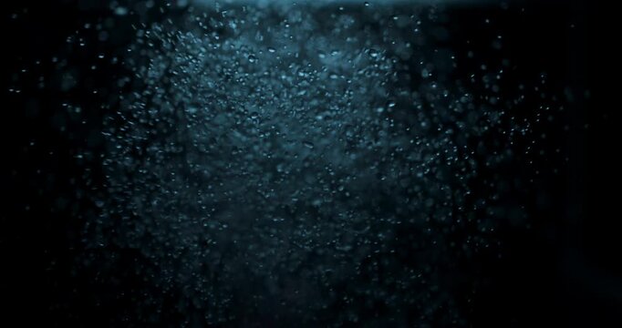 Clear water drops and bubbles create a vibrant, fluid abstract background with dynamic motion.