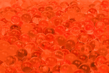 A close up of many red and orange balls