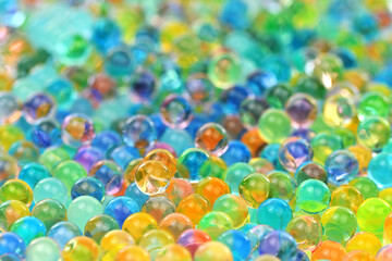 A bunch of colorful balls are scattered on a surface