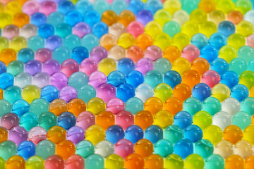 A colorful mosaic of small, clear, round beads