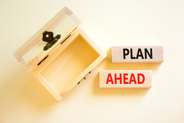 Plan ahead symbol. Concept word Plan ahead on beautiful wooden blocks. Beautiful white paper background. Empty wooden beautiful chest. Business plan ahead concept. Copy space.