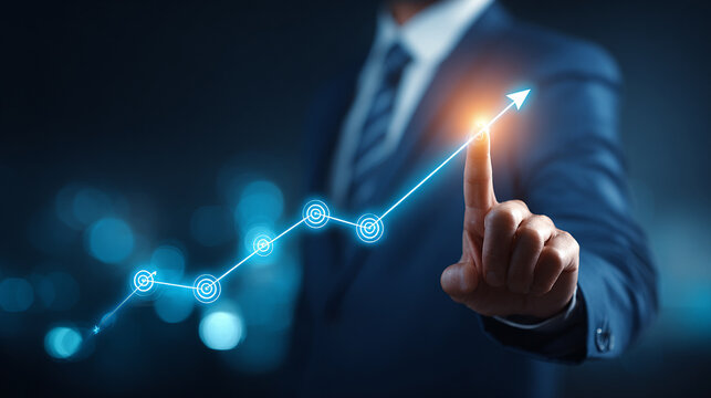 Businessman's hand pushes a digital power button on a virtual touchscreen interface, symbolizing technology growth and business success