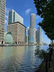 London, UK  Israel, 1 June 2025. A sunny day view of Canary Wharf in London with modern skyscrapers reflected in the water