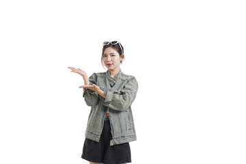 Presenting with Confidence: A young woman in stylish attire, radiating confidence, gestures towards an open space, creating a sense of possibility and showcasing a vision of the future.