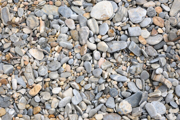 The shore of a pebble beach. Pavlos beach on the island of Amorgos. Greece