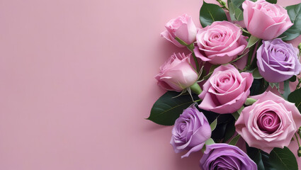 Soft pink and lavender roses arranged on a pastel pink background