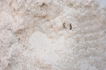 A close-up view of sand texture, natural background for design, construction, and nature concepts.