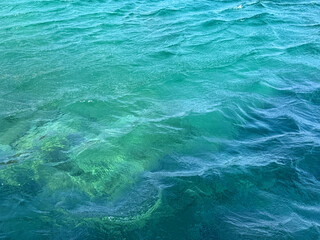 Sea ocean waves blue turquoise water surface aqua background.