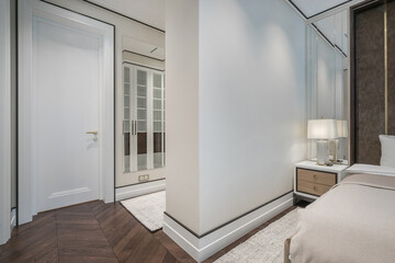Modern bedroom interior with clean lines and elegant design in a stylish apartment.