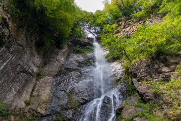 Shot of the beautiful mountain waterfall. Nature