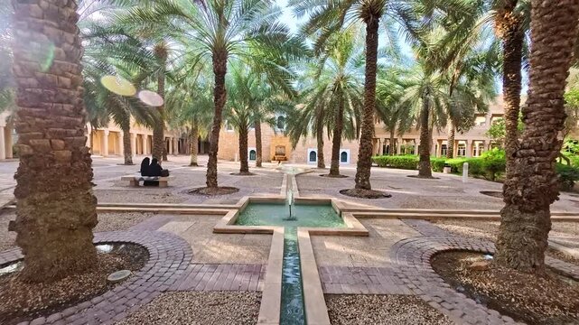 Riyadh, Saudi Arabia, 17.05.2025. Exterior of Al Murabba Historical Palace The Story of the Founding King s Palace in Riyadh. Walking area with a water fountain and many palm trees, old Arabic style.