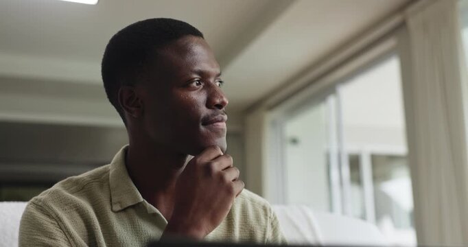 Black man, laptop and thinking in lounge with remote work from home, review and report for project management. Person, freelance writer and computer with reflection, decision or editing at apartment