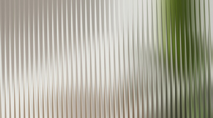 Fototapeta premium Green foliage blurred behind frosted glass texture