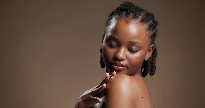 Skincare, face and shoulder with black woman in studio for beauty, body care and glow. Dermatology, mockup space and shine with person on brown background for aesthetic, clear skin and collagen