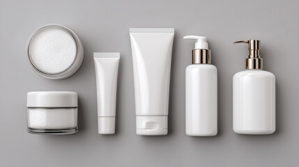 Flat lay of multiple skincare containers, including jars, tubes, and bottles, arranged symmetrically on a seamless pale gray background. Soft studio lighting creates a clean, modern mockup ready for b