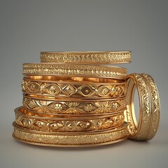Stacked gold bangles with intricate patterns and elegant designs.