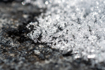 Melting Snow on Stone Surface