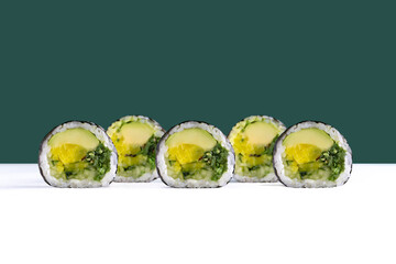 Vegetarian maki sushi roll with avocado, chuka and takuan

Japanese vegetable maki roll with avocado and seaweed salad

Classic vegan sushi roll with avocado and yellow radish
