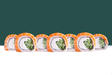 Salmon topped sushi roll with lettuce and cream cheese

Uramaki roll with salmon topping and salad filling

Classic japanese sushi roll with salmon and lettuce
