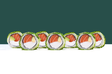 Philadelphia sushi roll with chuka seaweed topping and salmon

Uramaki roll topped with chuka salad and filled with salmon and avocado

Salmon and cream cheese sushi roll with seaweed topping