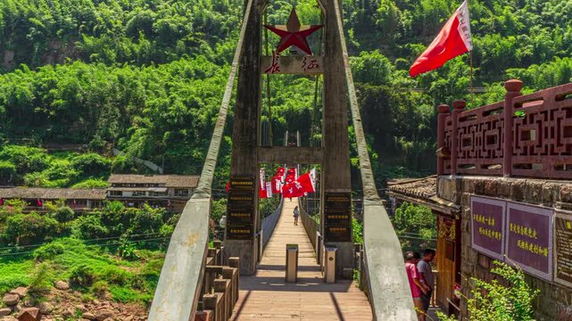 Chishui Sidu Bridge Time Lapse Ferry Crossing with Red Flags in Green Mountain Forest China