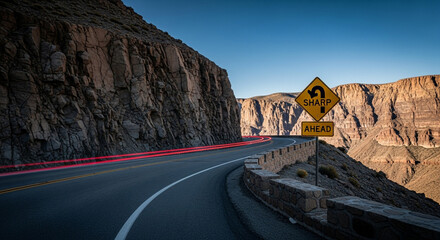 Experience the thrill of a winding mountain road at sunset with light trails capturing the journey's dynamic movement