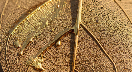 Macro shot of golden leaf veins with liquid gold texture