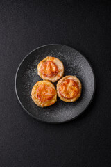 Round fish or chicken cutlets baked with tomato and cheese. Fish cutlets