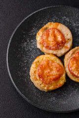 Round fish or chicken cutlets baked with tomato and cheese. Fish cutlets