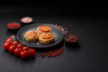 Round fish or chicken cutlets baked with tomato and cheese. Fish cutlets