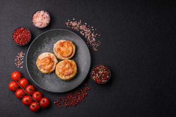 Round fish or chicken cutlets baked with tomato and cheese. Fish cutlets