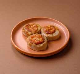 Round fish or chicken cutlets baked with tomato and cheese. Fish cutlets