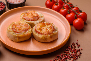 Round fish or chicken cutlets baked with tomato and cheese. Fish cutlets