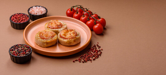 Round fish or chicken cutlets baked with tomato and cheese. Fish cutlets