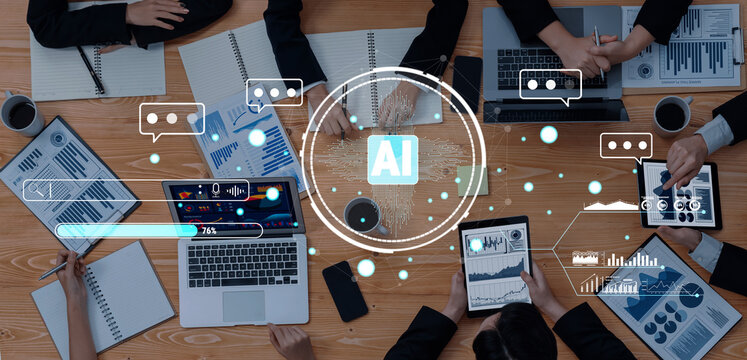 A dynamic collaborative workspace showcasing team members using technology for data analysis and discussions on artificial intelligence, driving innovation and business success. Trope - Powered by Adobe