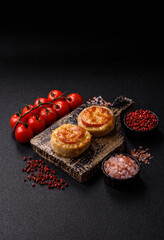 Round fish or chicken cutlets baked with tomato and cheese. Fish cutlets