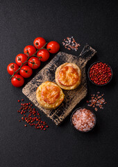 Round fish or chicken cutlets baked with tomato and cheese. Fish cutlets