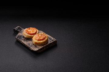 Round fish or chicken cutlets baked with tomato and cheese. Fish cutlets