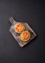 Round fish or chicken cutlets baked with tomato and cheese. Fish cutlets