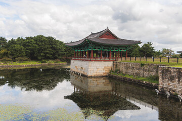Naklejka premium Gyeongju, South Korea, view of Donggung Palace and Wolji Pond in a sunny day, North Gyeongsang Province, Gyeongju city, Silla dinasty traditional Korean hanok architecture, Yeongnam region