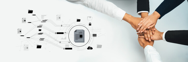 A group of diverse hands gathered together symbolizes teamwork and collaboration in a digital...