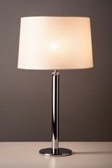 Elegant modern table lamp with white shade on minimalist desk