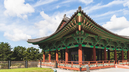 Fototapeta premium Gyeongju, South Korea, view of Donggung Palace and Wolji Pond in a sunny day, North Gyeongsang Province, Gyeongju city, Silla dinasty traditional Korean hanok architecture, Yeongnam region