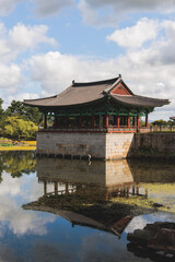 Fototapeta premium Gyeongju, South Korea, view of Donggung Palace and Wolji Pond in a sunny day, North Gyeongsang Province, Gyeongju city, Silla dinasty traditional Korean hanok architecture, Yeongnam region