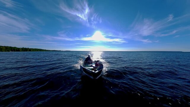 Fishermen on vacation, boating in lake Manitou, Manitoulin Island, Ontario, Canada. End of fishing game tournament. Water sport at fall. Power sport fishing and watersport.