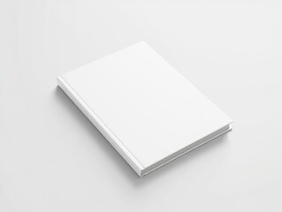 A clean, minimalist white hardcover book lies closed on a soft white surface, casting a subtle shadow — perfect for branding, design mockups, or editorial use.