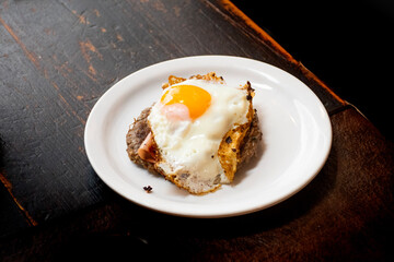 dish of meat hambuger with egg and ham