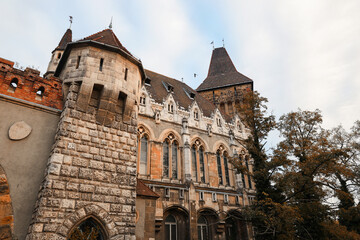 Stone fortress wall and old architecture detail of European castle in fall season.