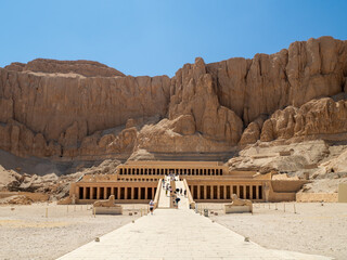 LUXOR, EGYPT : The Mortuary Temple of Hatshepsut at Valley of the Queens, an impressive ancient Egyptian monument built into limestone cliffs, visited by travelers from around the world.