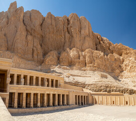 LUXOR, EGYPT : The Mortuary Temple of Hatshepsut at Valley of the Queens, an impressive ancient Egyptian monument built into limestone cliffs, visited by travelers from around the world.